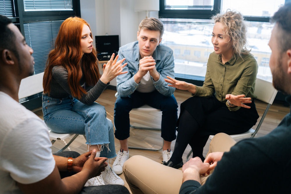 small group sitting in chairs