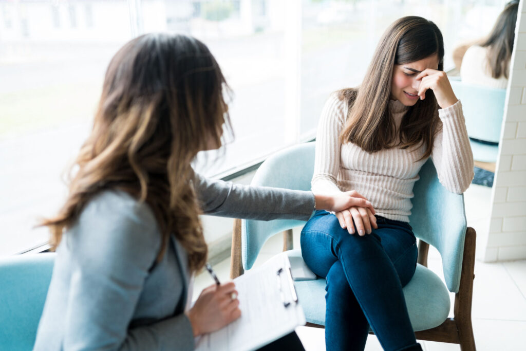 woman crying during a therapy session