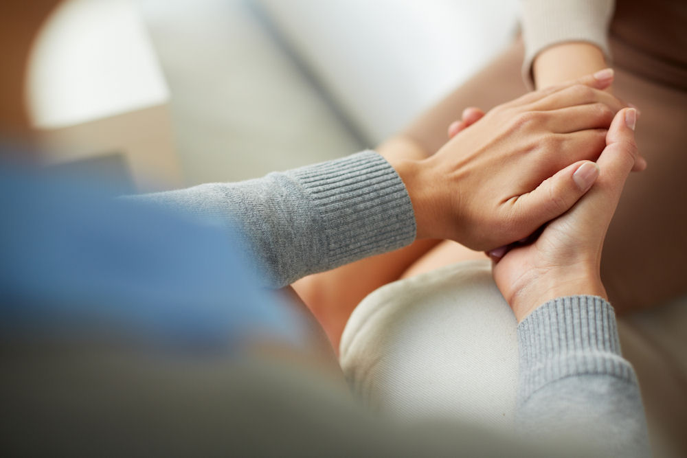 family member comforting loved one