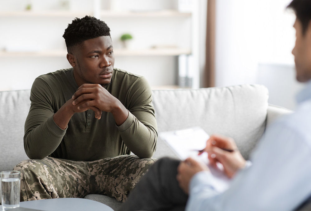 veteran sitting in therapy setting