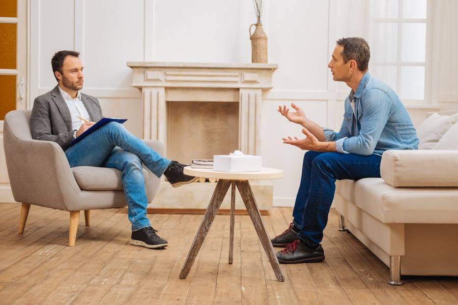 man talking to therapist