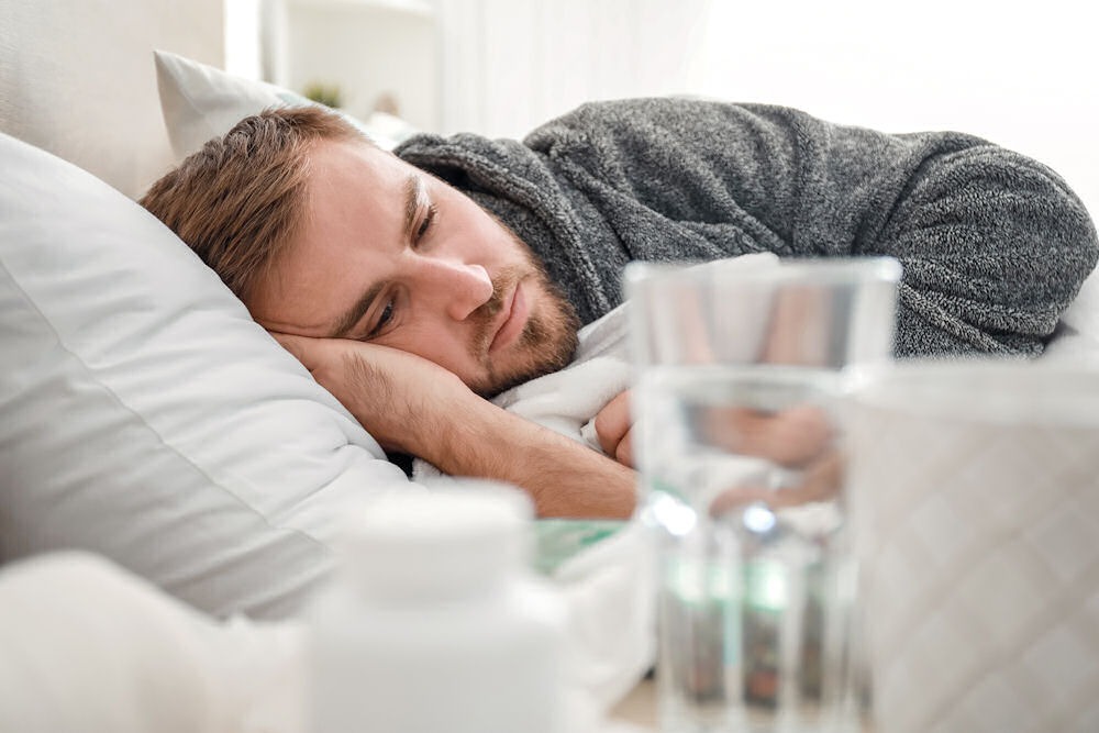 a man with addiction problem lying on bed