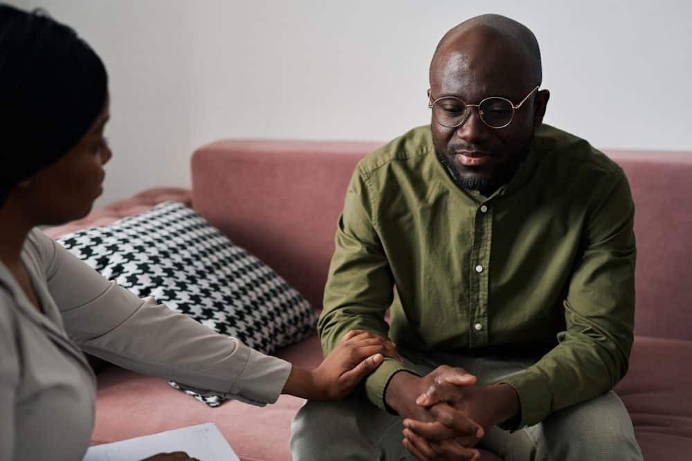 Man receiving support during counseling, discussing Dry January health benefits