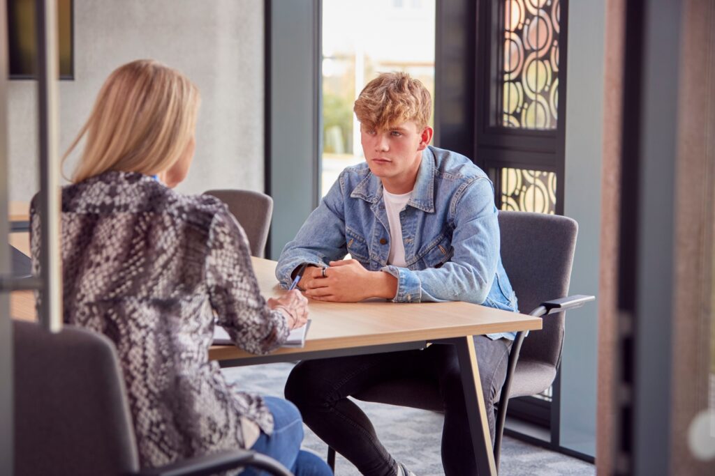 young man meeting with therapist for drug addiction   behavior changes in drug abusers