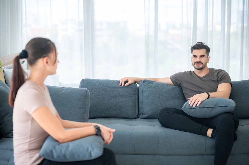 couple talking on couch